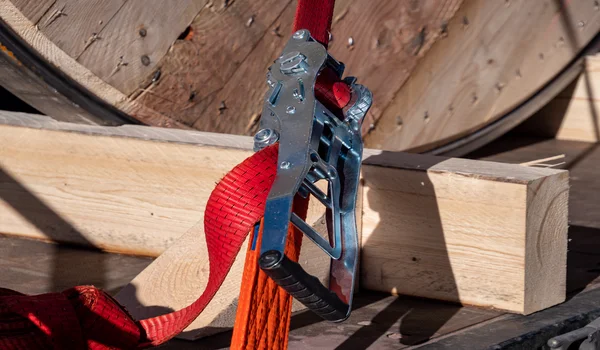 CERTEX Lifting's red ratchet fastener secures a truck's haulage load.